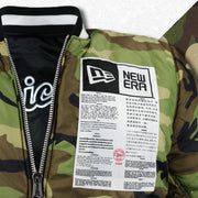 The New Era Sports Unite Us Graphic on the Chicago White Sox MLB Patch Alpha Industries Reversible Bomber Jacket With Camo Liner | Black Bomber Jacket