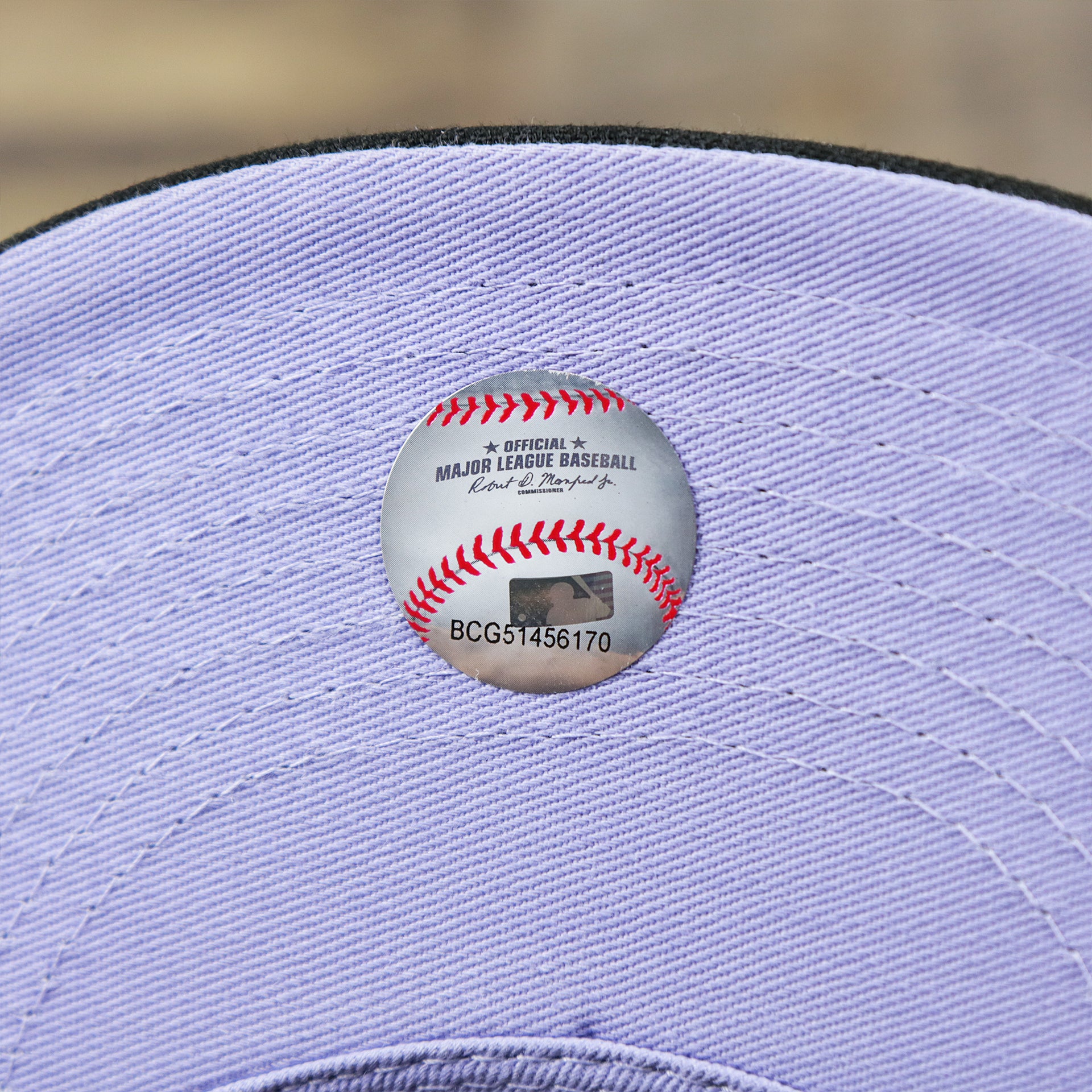 The MLB Baseball Sticker on the Chicago White Sox Pop Sweat Pastel World Series Side Patch Fitted Cap With Purple Undervisor | Black 59Fifty Cap