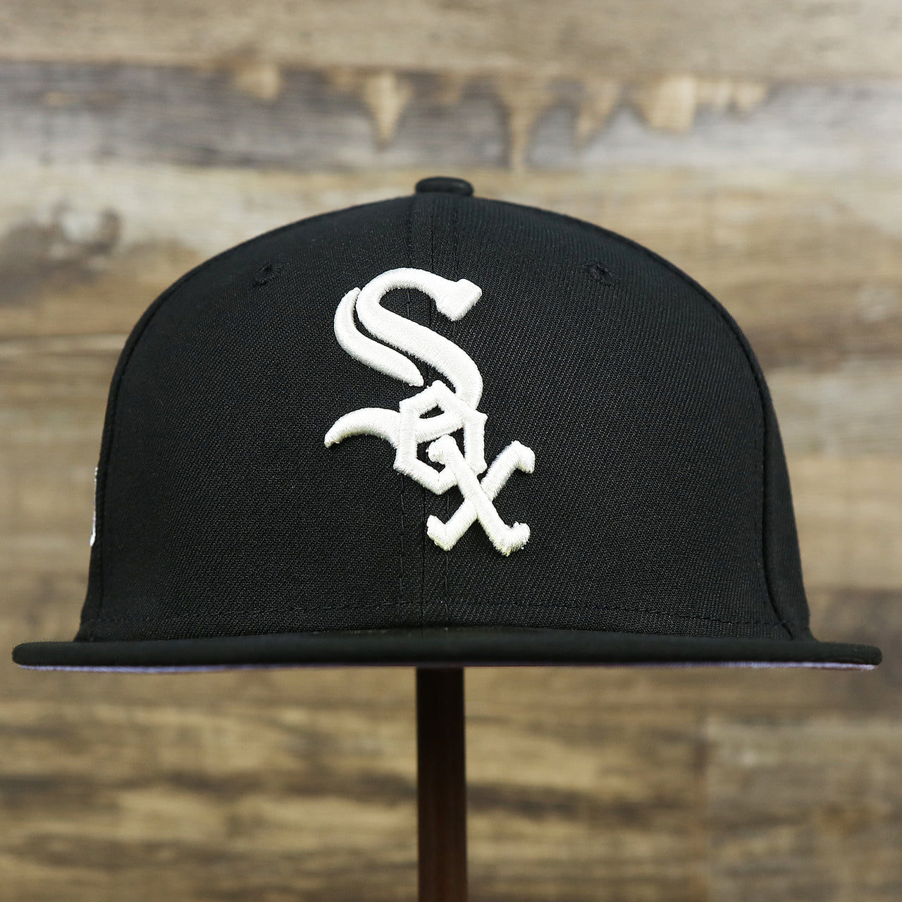 The front of the Chicago White Sox Pop Sweat Pastel World Series Side Patch Fitted Cap With Purple Undervisor | Black 59Fifty Cap