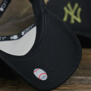 The Black Undervisor on the New York Yankees Alpha Industries Flying A Mesh Print 9Forty Trucker Hat With Flight Tag | Black Trucker Hat