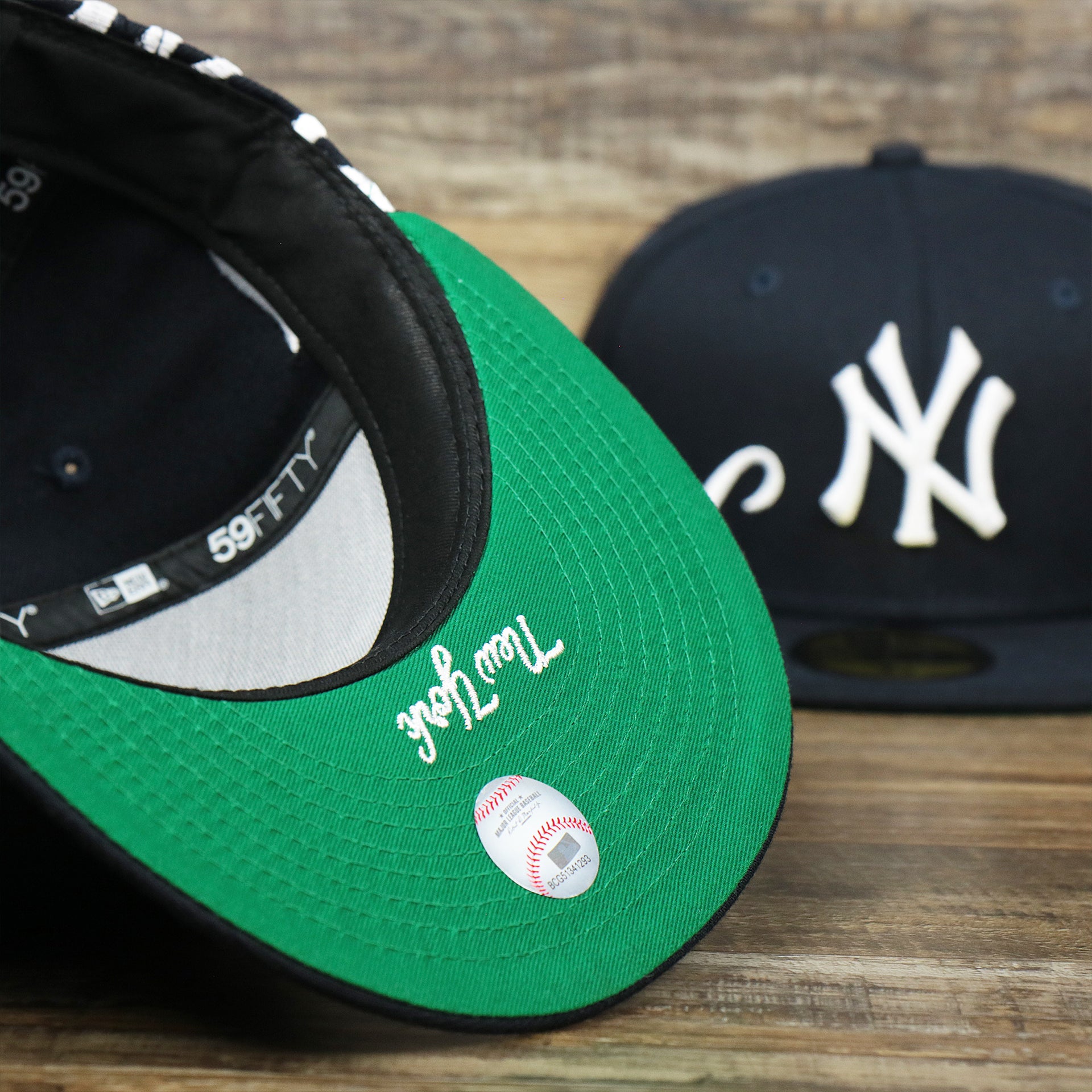 The undervisor on the New York Wordmark Side Split New York Yankees Vintage Green Bottom Embroidered Undervisor Fitted Cap | Navy Blue 59Fifty Cap