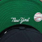 The New York Logo on the New York Wordmark Side Split New York Yankees Vintage Green Bottom Embroidered Undervisor Fitted Cap | Navy Blue 59Fifty Cap