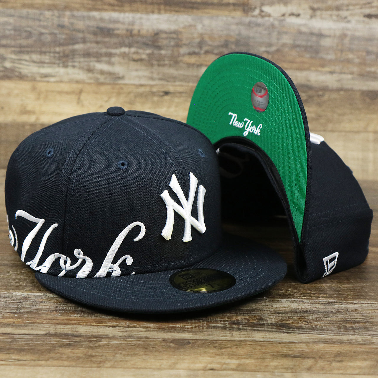 The New York Wordmark Side Split New York Yankees Vintage Green Bottom Embroidered Undervisor Fitted Cap | Navy Blue 59Fifty Cap