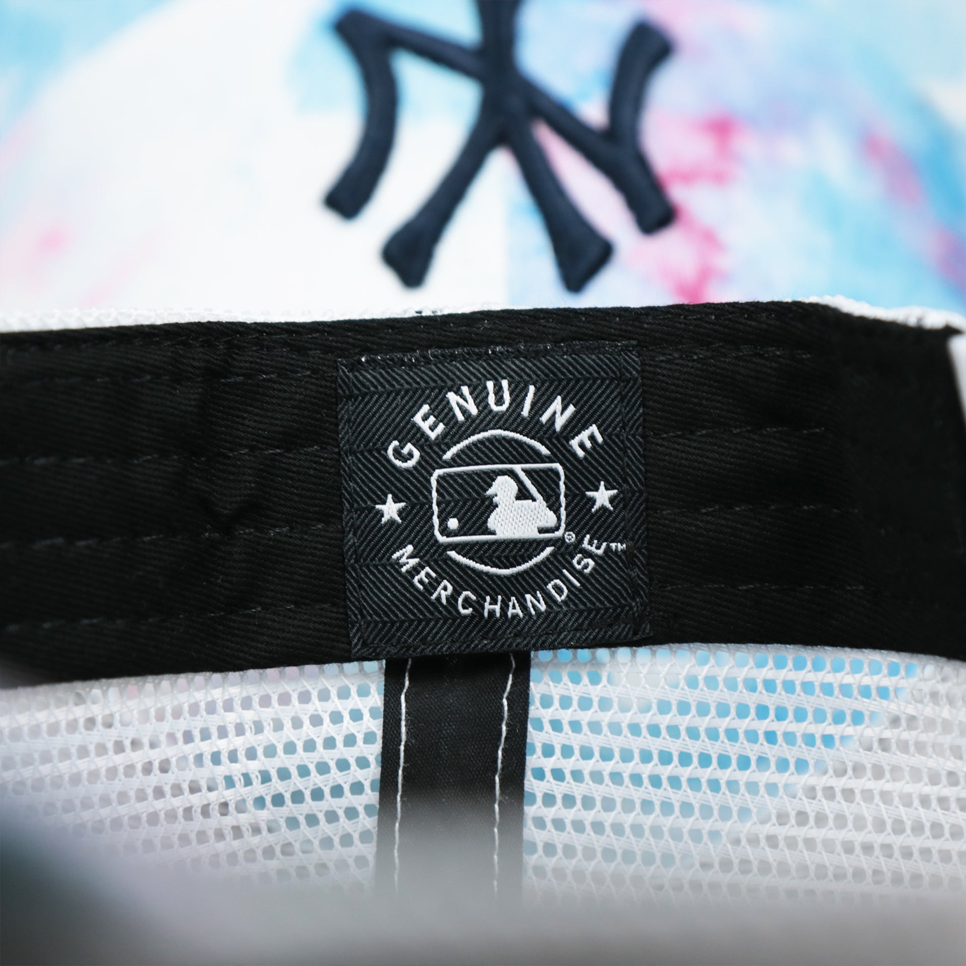 The MLB Merchandise Tag on the Women’s New York Yankees Tie Dye Print Gray Bottom Mesh Trucker Hat | White Mesh Snapback