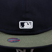 The MLB Batterman Logo on the New York Yankees Alpha Industries Side Patch Army Green Undervisor 59FIfty Fitted Cap With Hangtag | Navy Blue 59FIfty Cap