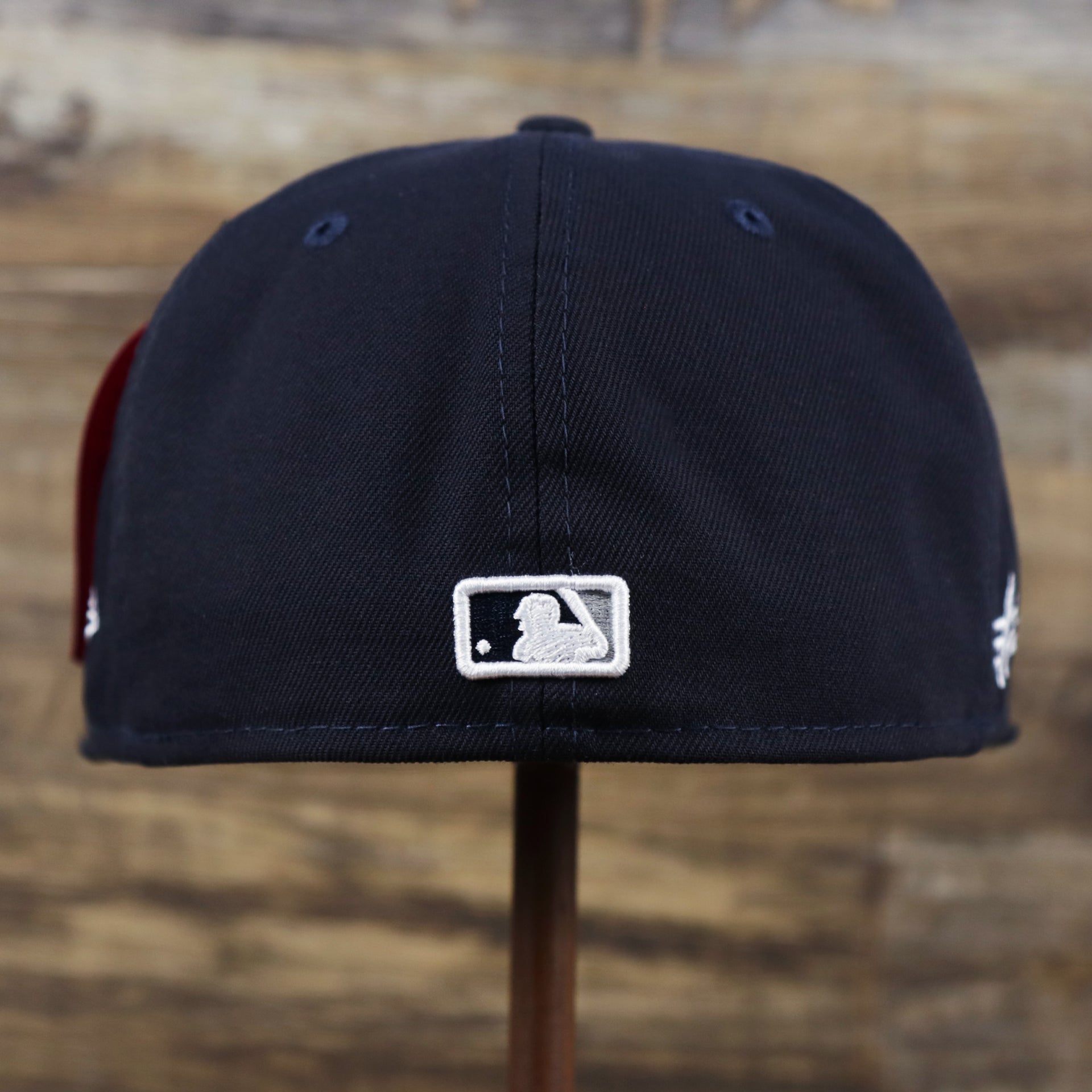 The backside of the New York Yankees Alpha Industries Side Patch Army Green Undervisor 59FIfty Fitted Cap With Hangtag | Navy Blue 59FIfty Cap