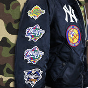 The Yankees World Series Wins Side Patches on the New York Yankees MLB Patch Alpha Industries Reversible Bomber Jacket With Camo Liner | Navy Blue Bomber Jacket