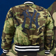 The backside of the Camo Liner on the New York Yankees MLB Patch Alpha Industries Reversible Bomber Jacket With Camo Liner | Navy Blue Bomber Jacket