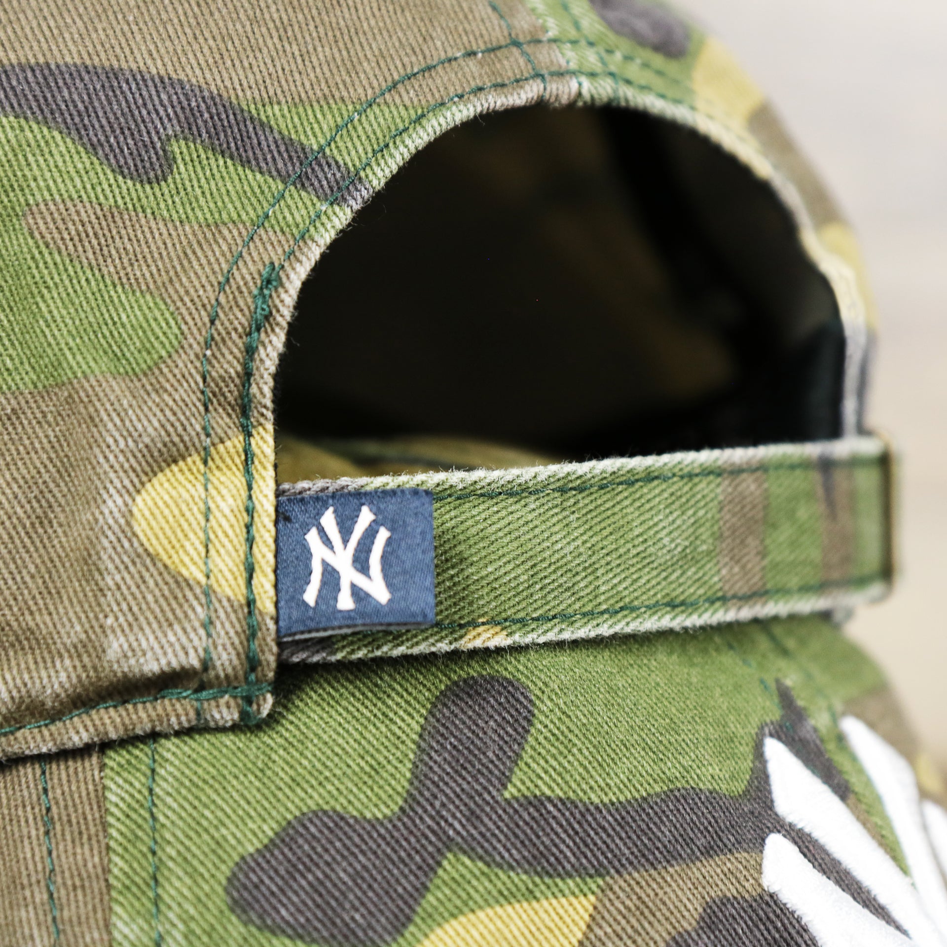 The Yankees Tag on the New York Yankees Camouflage Dad Hat with White Logo | Camo Dad Hat