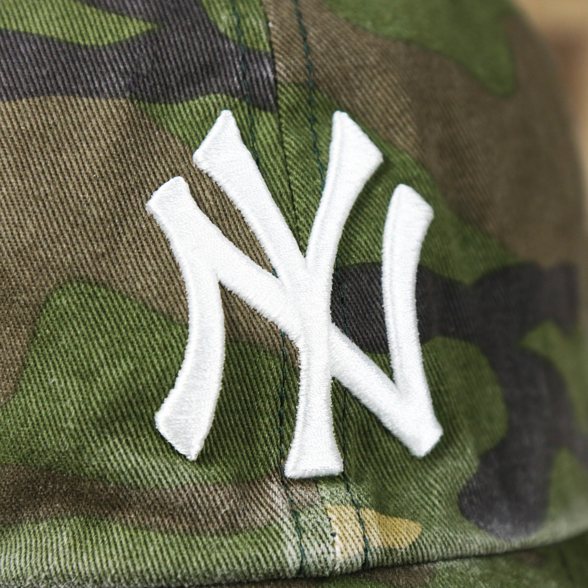 The Yankees Logo on the New York Yankees Camouflage Dad Hat with White Logo | Camo Dad Hat