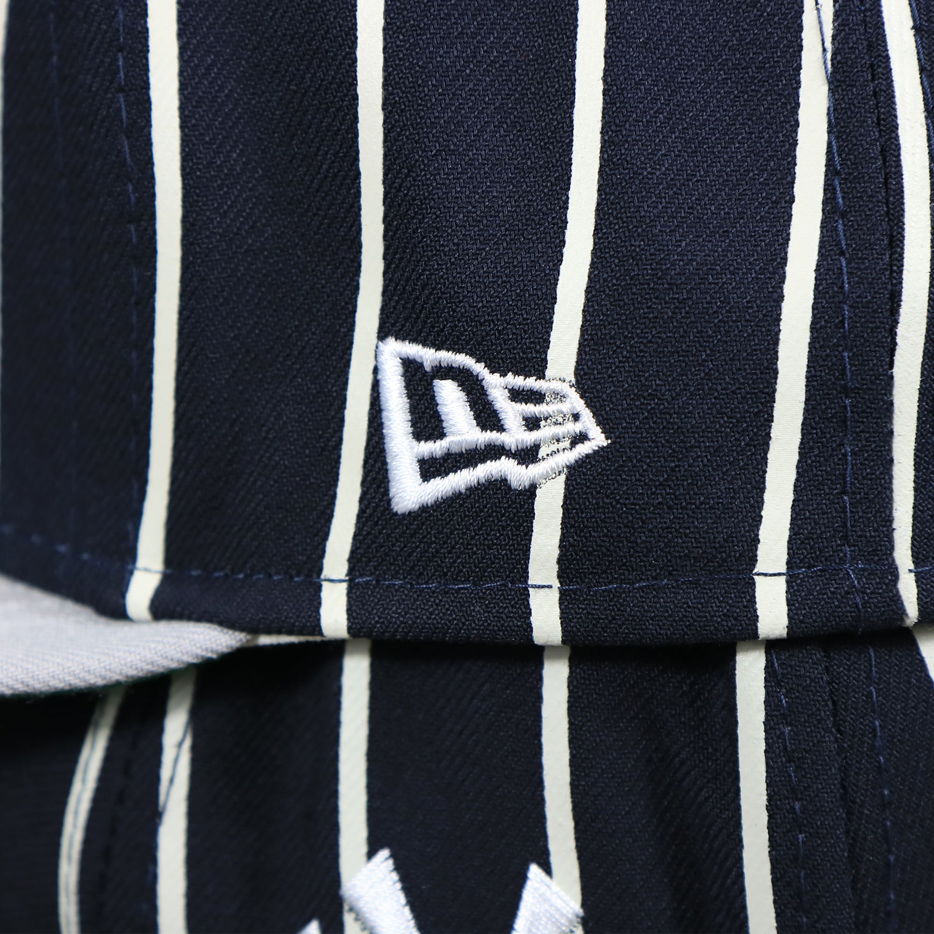 The New Era Logo on the New York Yankees City Arch Striped 9Fifty Snapback Cap | Pin Stripe 9Fifty Cap
