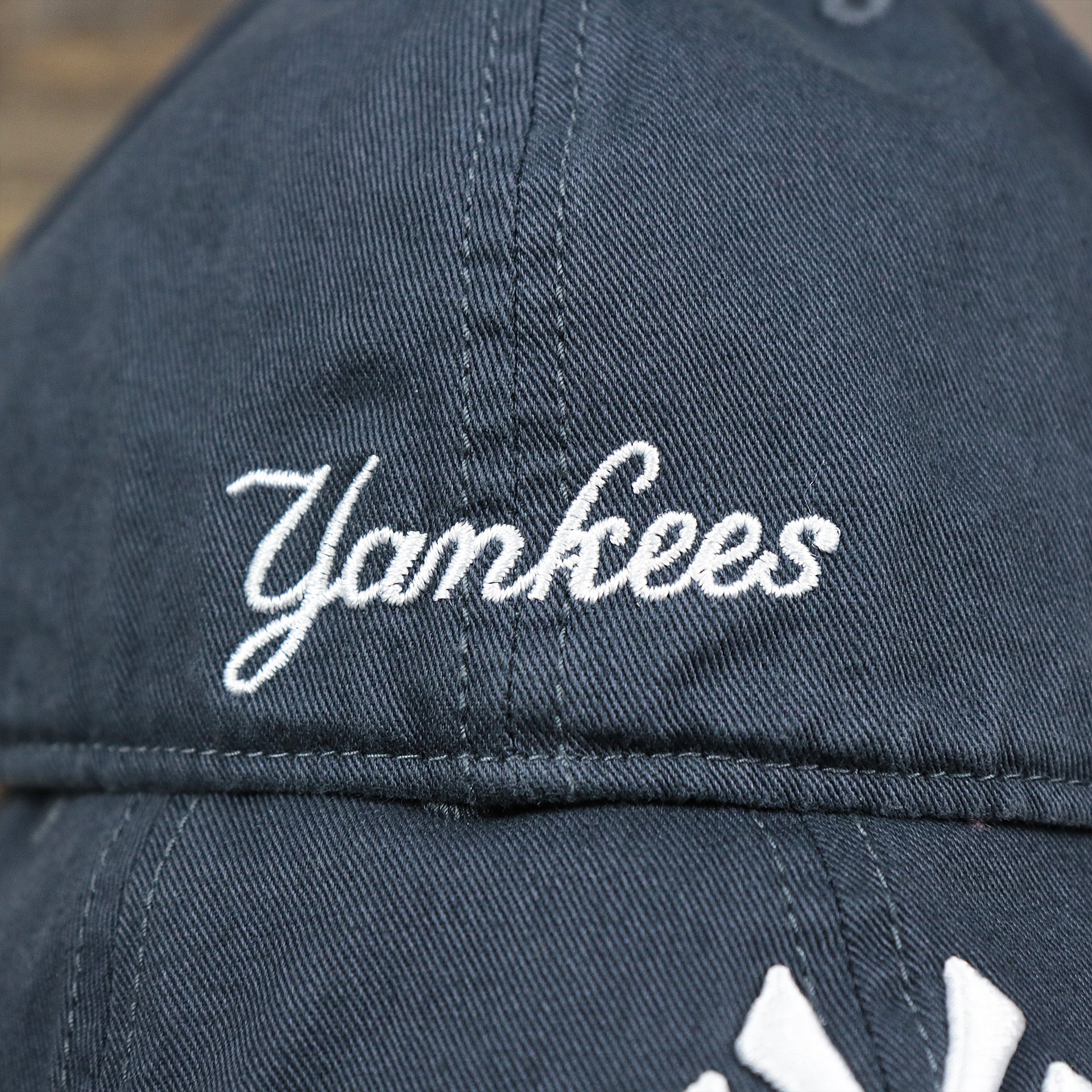 The Yankees Wordmark on the Cooperstown New York Yankees Green Bottom Yankees Wordmark Fitted Cap | Vintage Navy Fitted Cap