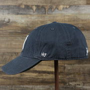 The wearer's left on the Cooperstown New York Yankees Green Bottom Yankees Wordmark Fitted Cap | Vintage Navy Fitted Cap