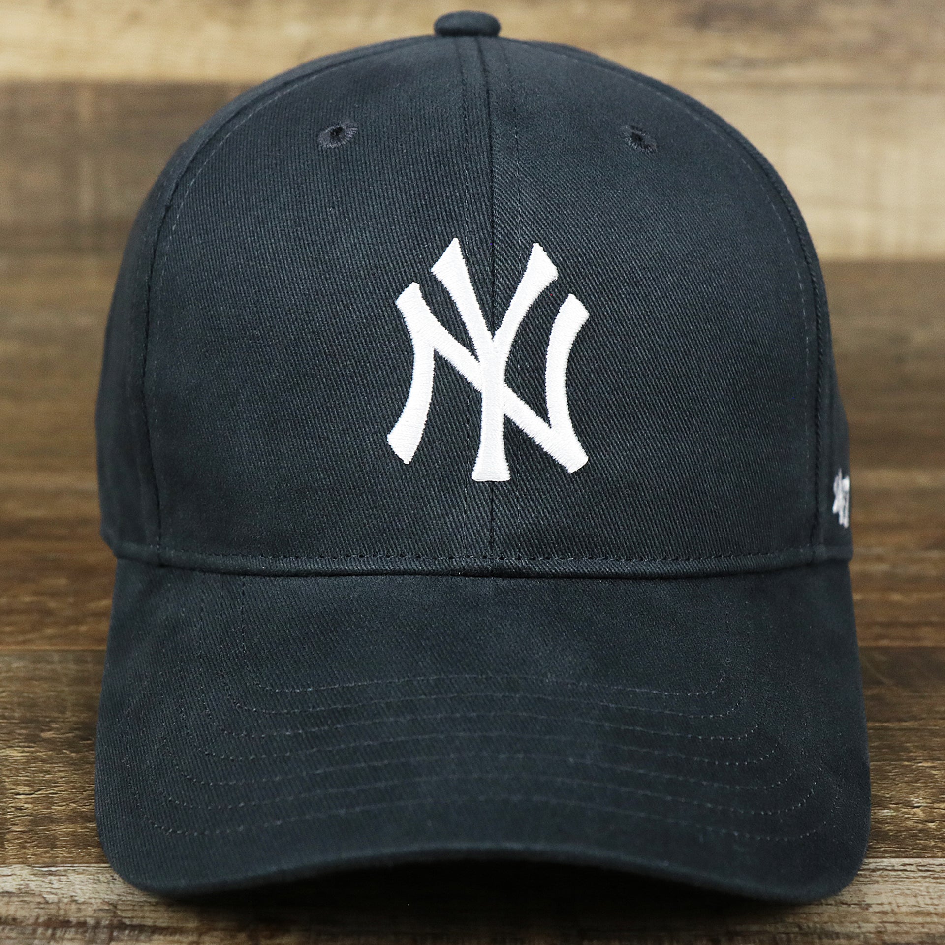 The front of the Kid’s New York Yankees Gray Bottom Dad Hat | Navy Kid’s Dad Hat