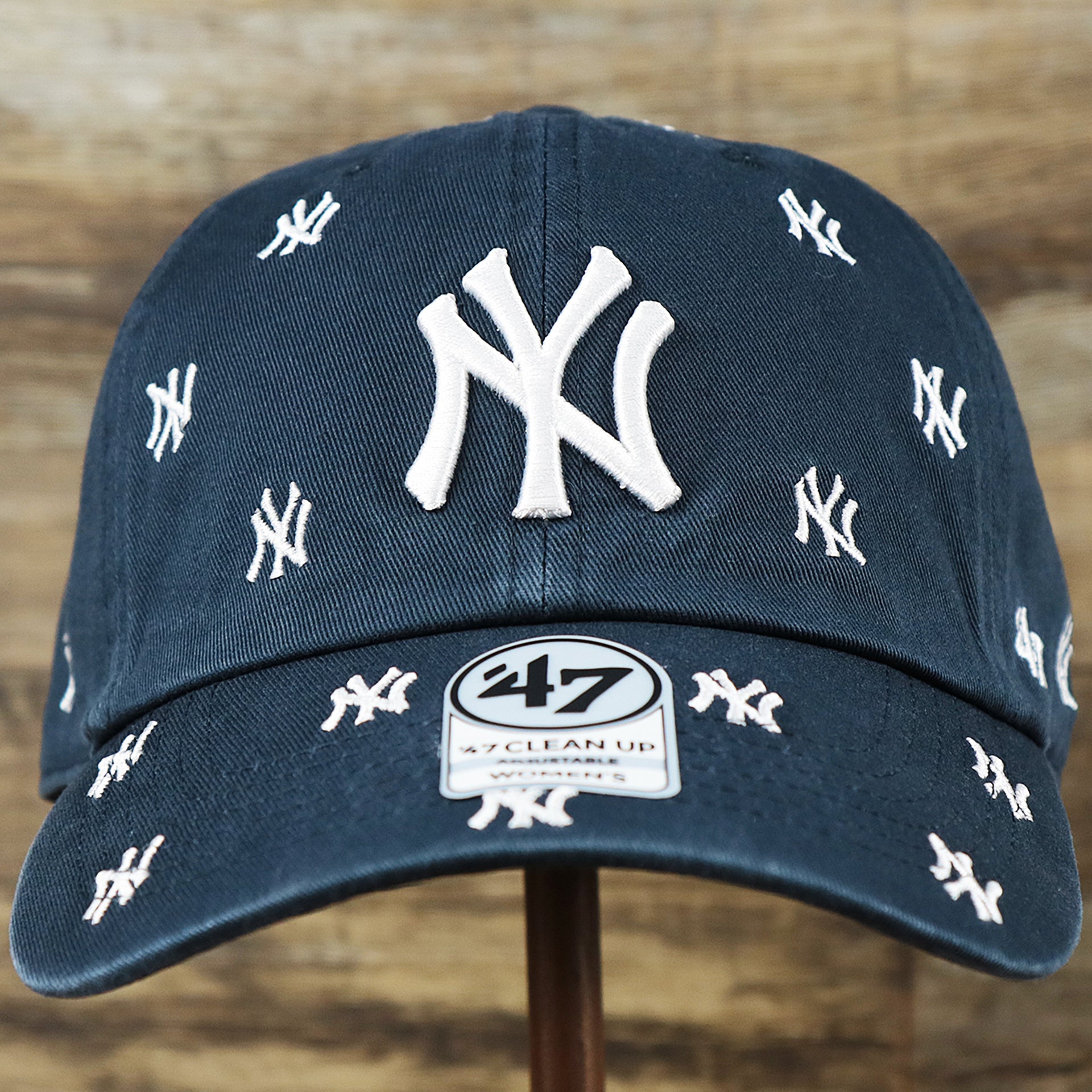 The front of the Women’s New York Yankees All Over Yankees Logo Dad Hat | Navy Women’s Dad Hat