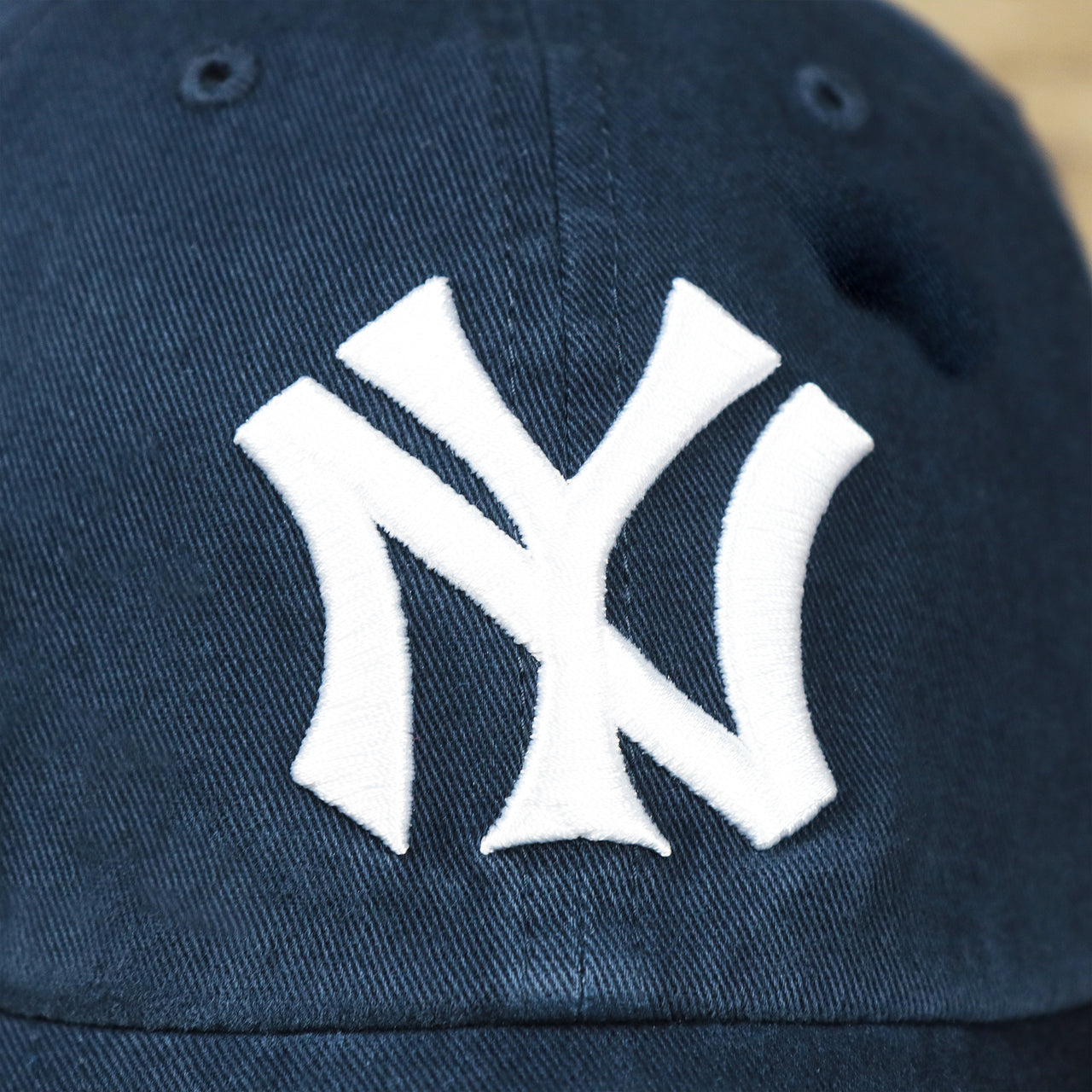 The Yankees Logo on the Cooperstown New York Yankees Retro Yankees Logo Dad Hat | Navy Dad Hat