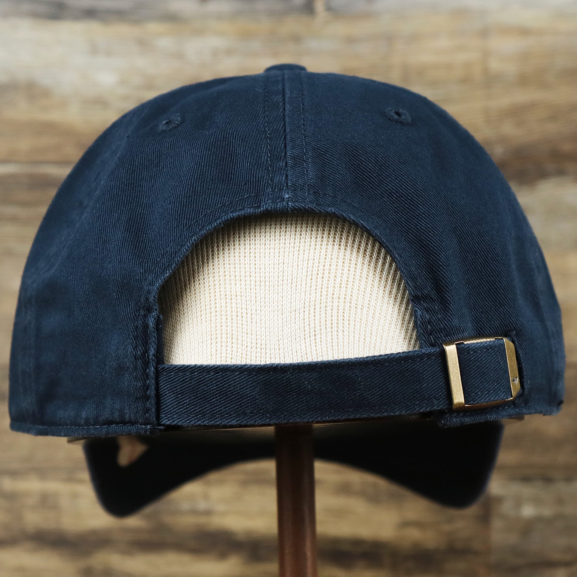 The backside of the Cooperstown New York Yankees Retro Yankees Logo Dad Hat | Navy Dad Hat