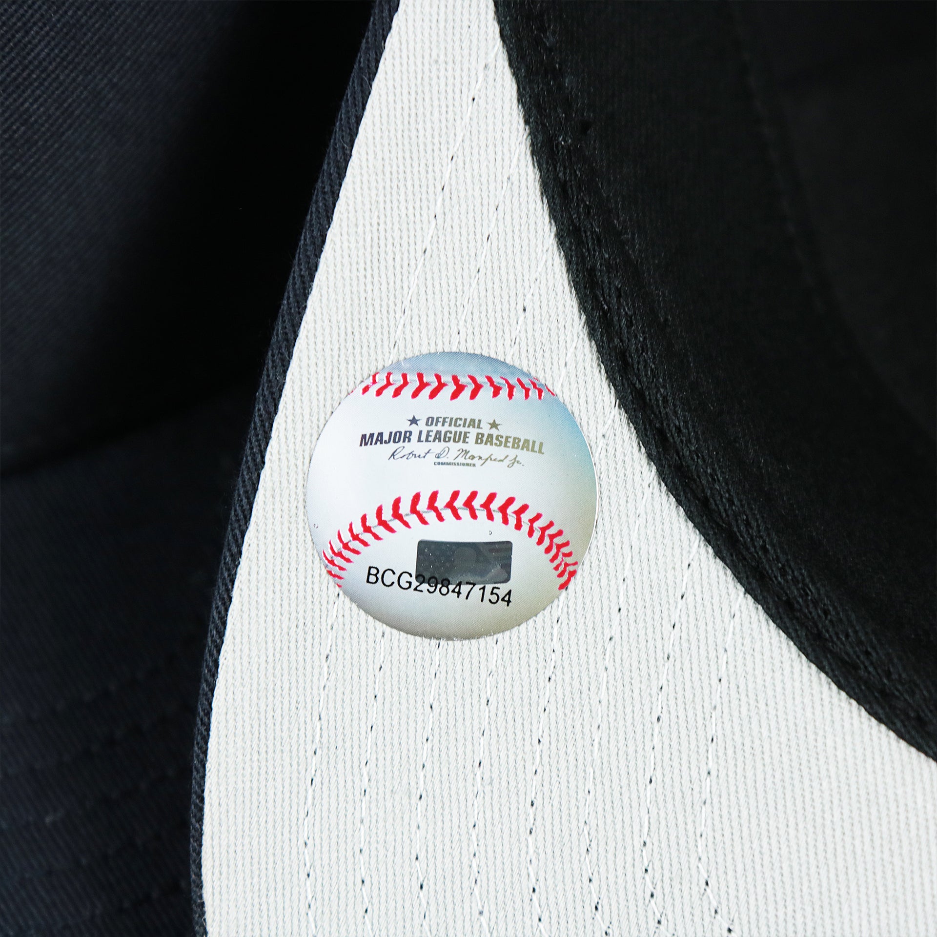 The MLB Baseball Tag on the New York Yankees Mesh Back Gray Bottom Trucker Hat | Navy Blue Dad Hat