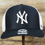 The front of the New York Yankees Mesh Back Gray Bottom Trucker Hat | Navy Blue Dad Hat