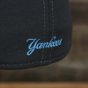 The word yankees embroidered on the New York Yankees 2022 Father's Day On-Field 39Thirty Flexfit Cap | Gray