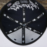The inside of the New York Yankees Crown Champions Gray Bottom World Championship Wins Embroidered Fitted Cap | Navy Blue 59Fifty Cap