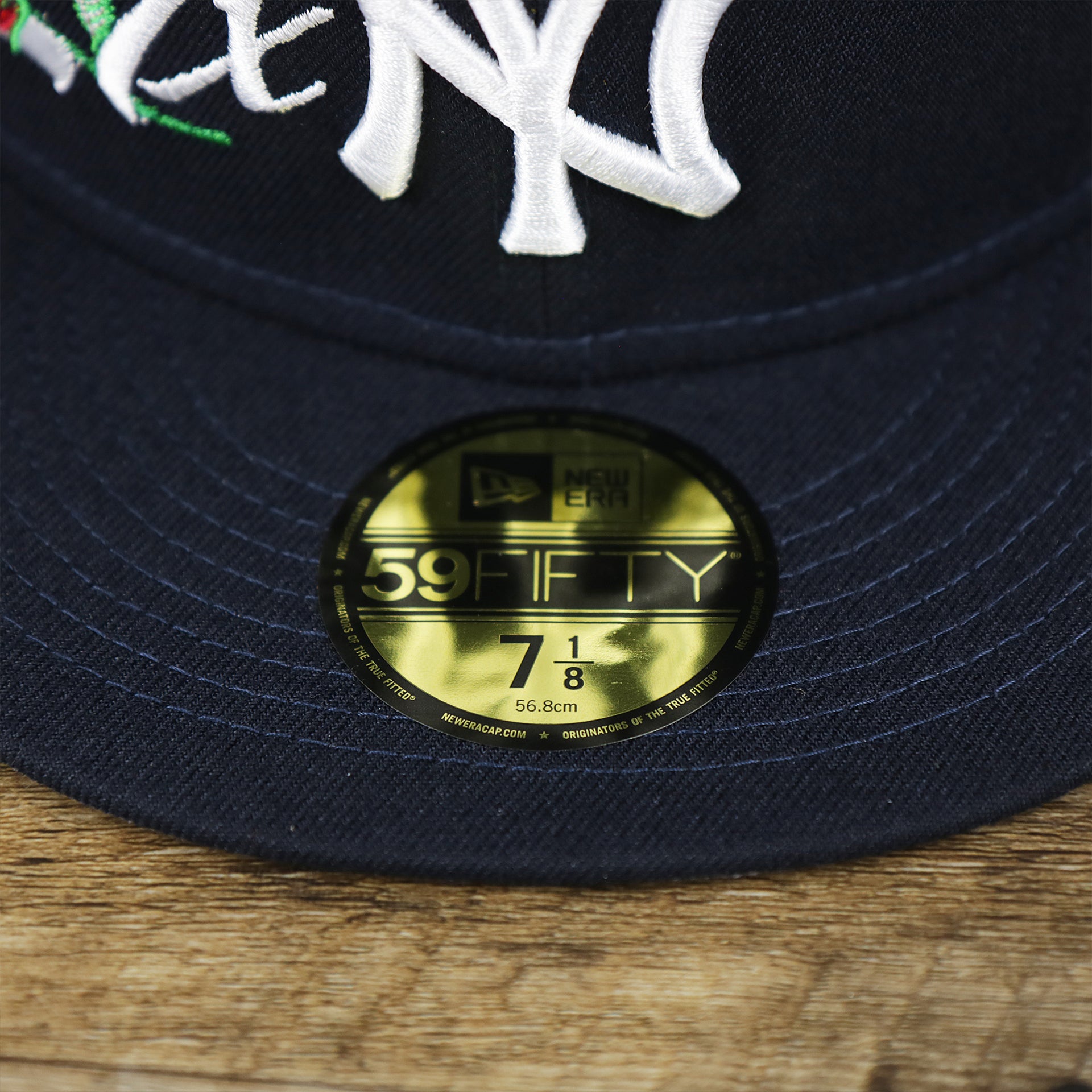 The 59Fifty Sticker on the New York Yankees Crown Champions Gray Bottom World Championship Wins Embroidered Fitted Cap | Navy Blue 59Fifty Cap