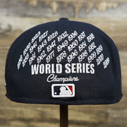The backside of the New York Yankees Crown Champions Gray Bottom World Championship Wins Embroidered Fitted Cap | Navy Blue 59Fifty Cap