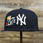 The front of the New York Yankees Crown Champions Gray Bottom World Championship Wins Embroidered Fitted Cap | Navy Blue 59Fifty Cap