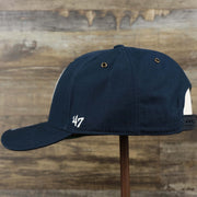 The wearer's left on the Cooperstown New York Yankees Felt Yankees Logo Snapback Hat | Navy Snapback Cap