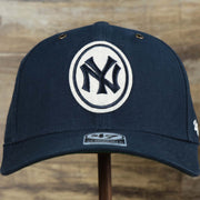 The front of the Cooperstown New York Yankees Felt Yankees Logo Snapback Hat | Navy Snapback Cap