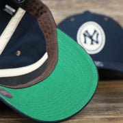 The Green Undervisor on the Cooperstown New York Yankees Felt Yankees Logo Snapback Hat | Navy Snapback Cap