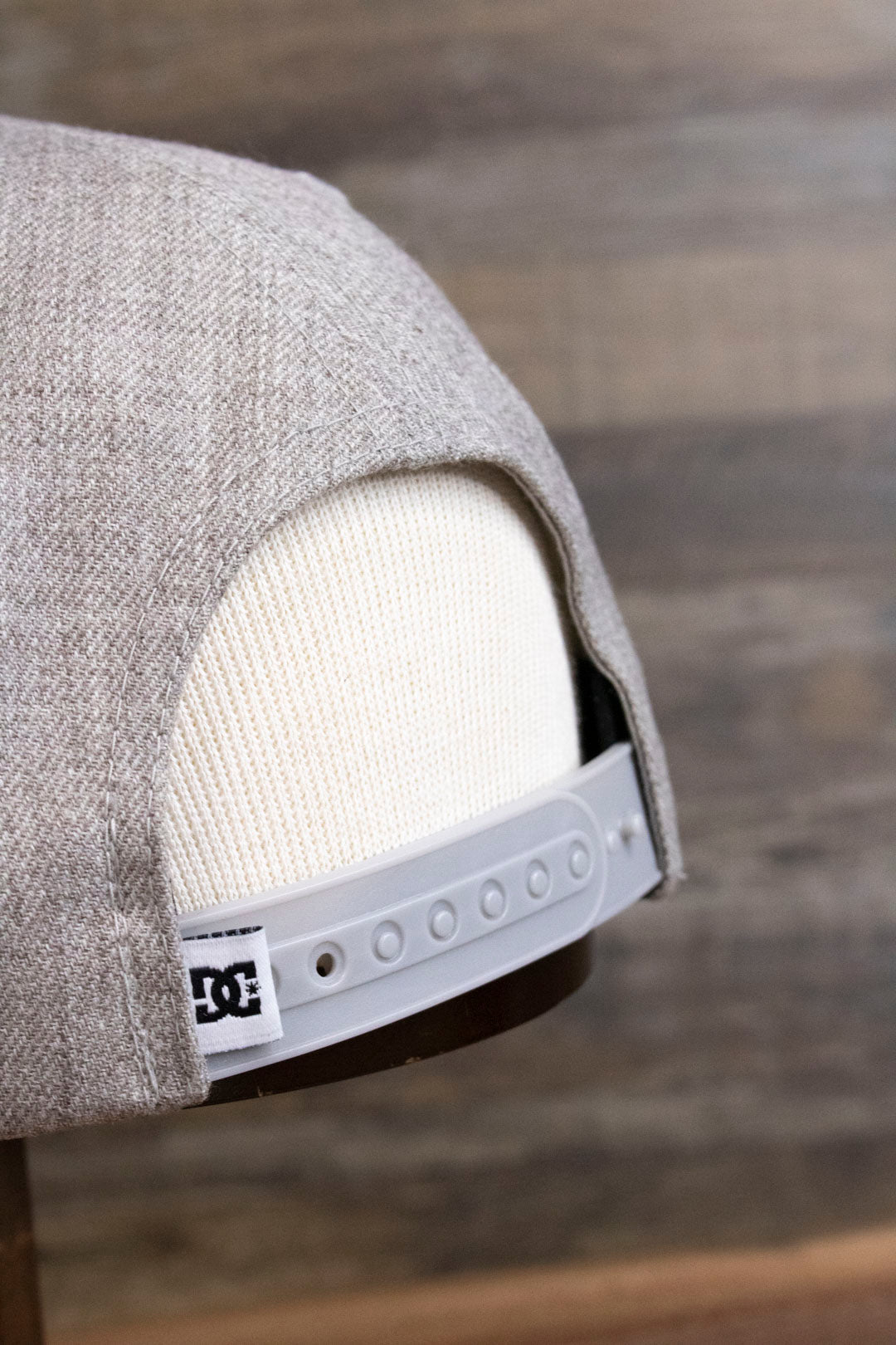 there is a small DC ribbon attached to the back of the 2-Tone Gray Snapback Skater Hat | DC Shoes Black Bottom Snap Back Cap