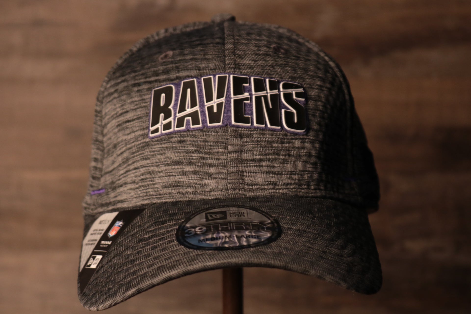 Ravens 2020 Training Camp Flexfit | Baltimore Ravens 2020 On-Field Grey Training Camp Stretch Fit  the front of this ravens cap has the ravens name on the front