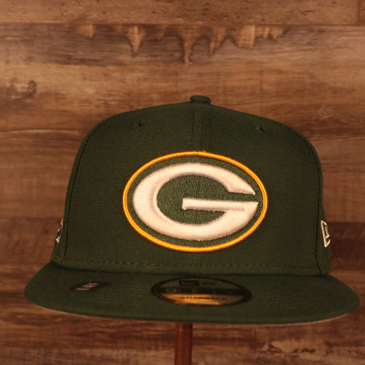 front of the Green Bay Packers "Patch Up" Super Bowl XXXI Side Patch Gray Bottom 9Fifty Navy Snapback Hat