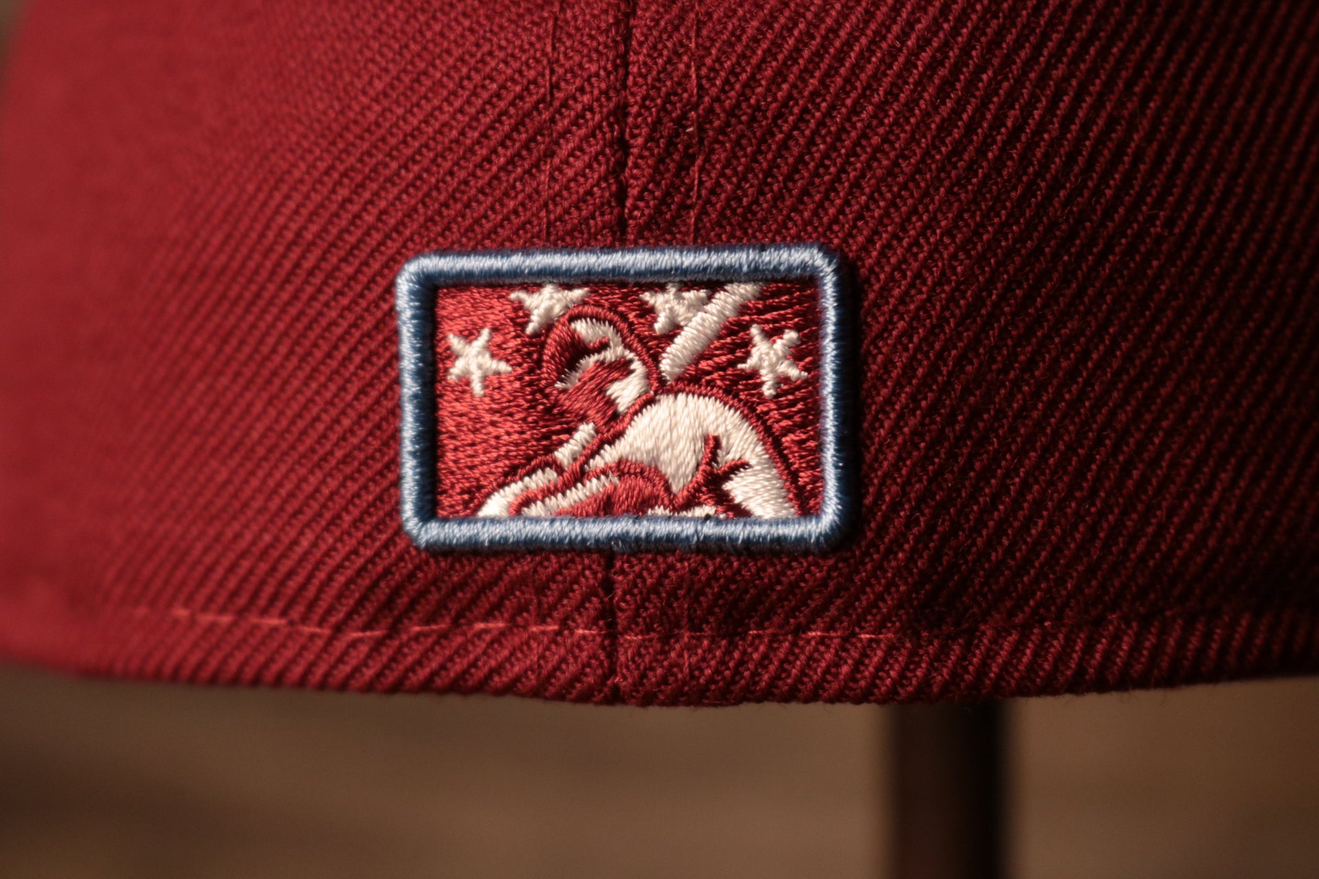 the minor league logo is burgundy and light blue Grey Bottom Fitted Cap | Jawn Burgundy Gray Bottom Fitted Hat