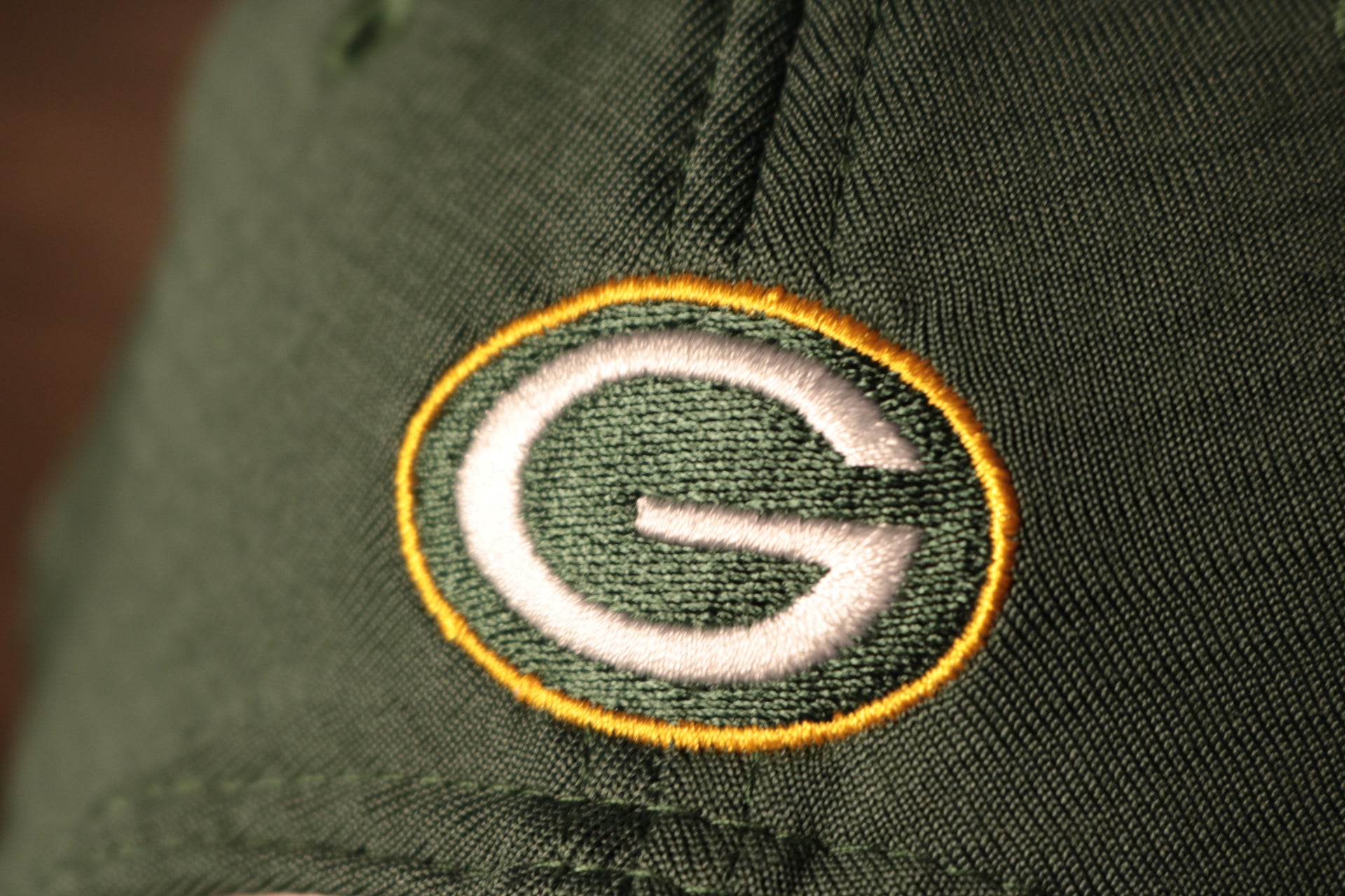 The packers logo is on the back of this cap Packers 2020 Training Camp Snapback Hat | Green Bay Packers 2020 On-Field Green Training Camp Snap Cap