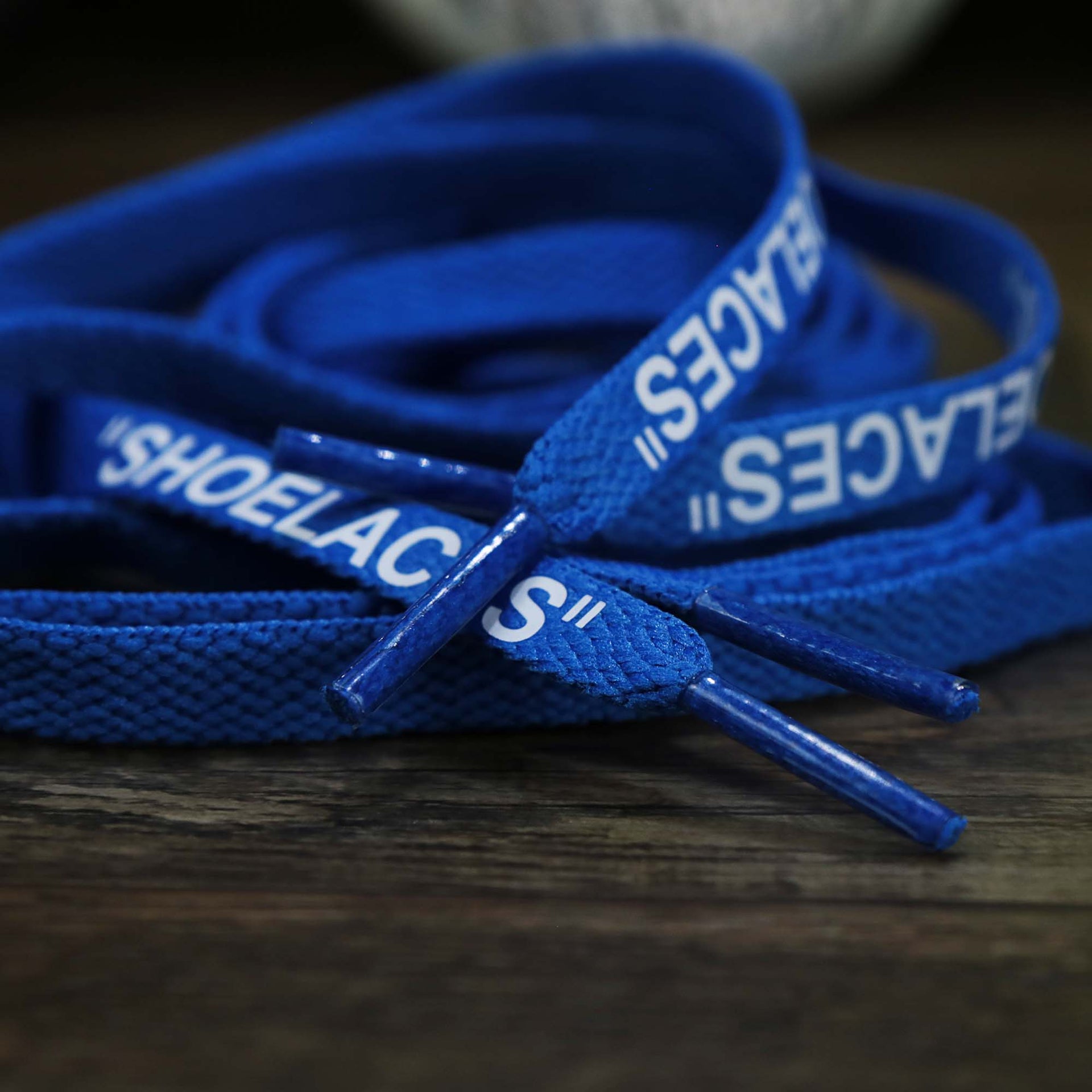 The aglets on the Flat Blue Shoelaces with “Shoelaces” Print | 120cm Capswag