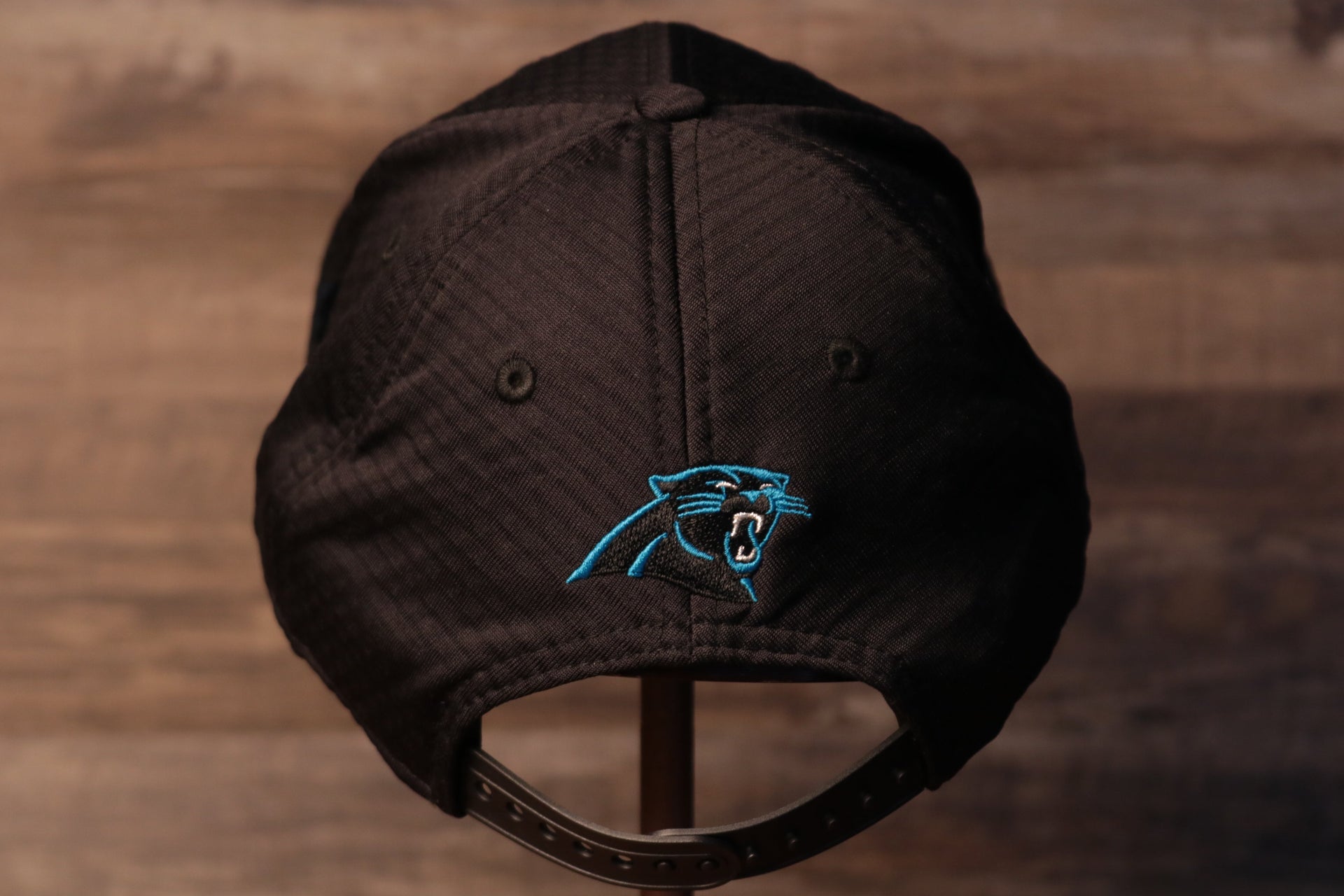 Panthers 2020 Training Camp Snapback Hat | Carolina Panthers 2020 On-Field Black Training Camp Snap Cap the back side has the panthers logo right above the adjustable snap