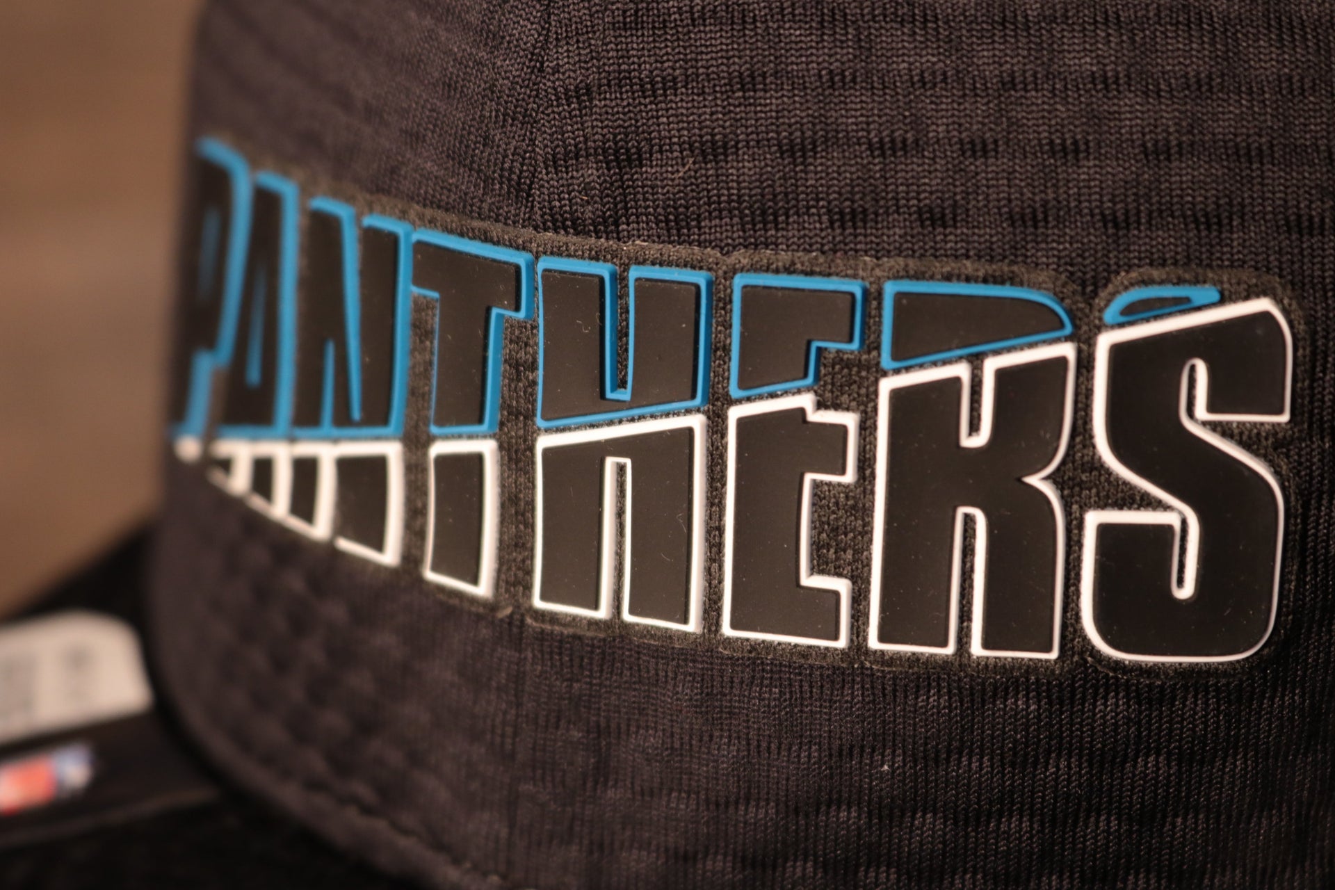 Panthers 2020 Training Camp Snapback Hat | Carolina Panthers 2020 On-Field Black Training Camp Snap Cap the team name on the front is half white and half teal