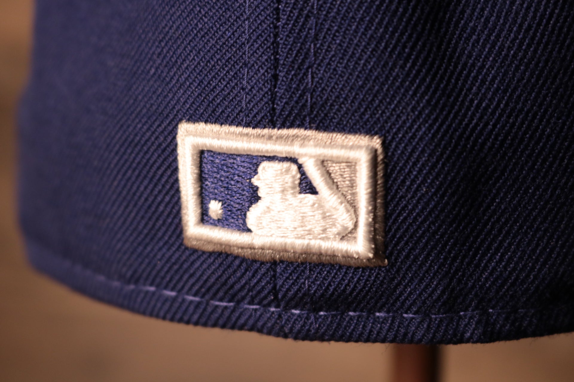 The mlb logo is on the back Dodgers Gray Bottom Fitted Cap | Los Angeles Dodgers Grey Bottom Royal Blue Fitted Hat