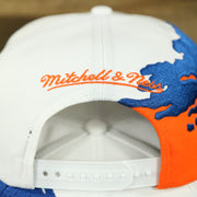 mitchell and ness logo on the University of Florida Vintage Retro NCAA Paintbrush Mitchell and Ness Snapback Hat | Orange/Blue/White