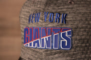 the giants logo is blue Giants 2020 Training Camp Flexfit | New York Giants 2020 On-Field Grey Training Camp Stretch Fit