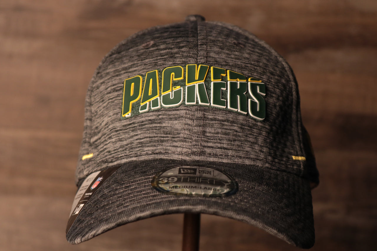 Packers 2020 Training Camp Flexfit | Green Bay Packers 2020 On-Field Grey Training Camp Stretch Fit  the front of this packers hat has the packers name