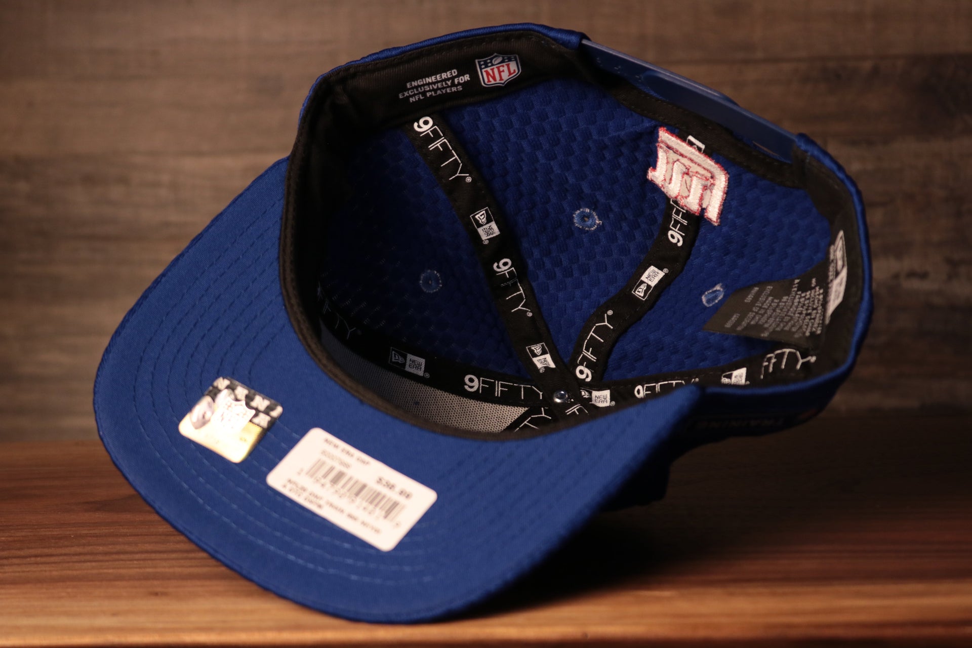 the underbrim is blue Giants 2020 Training Camp Snapback Hat | New York Giants 2020 On-Field Red Training Camp Snap Cap