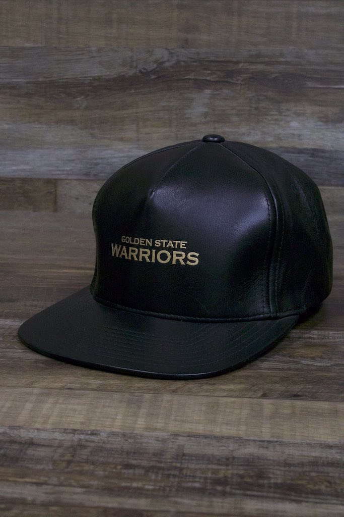 the Golden State Warriors Leather Snapback | Black Warriors Snap Back with Gold Foil Design is made of real leather