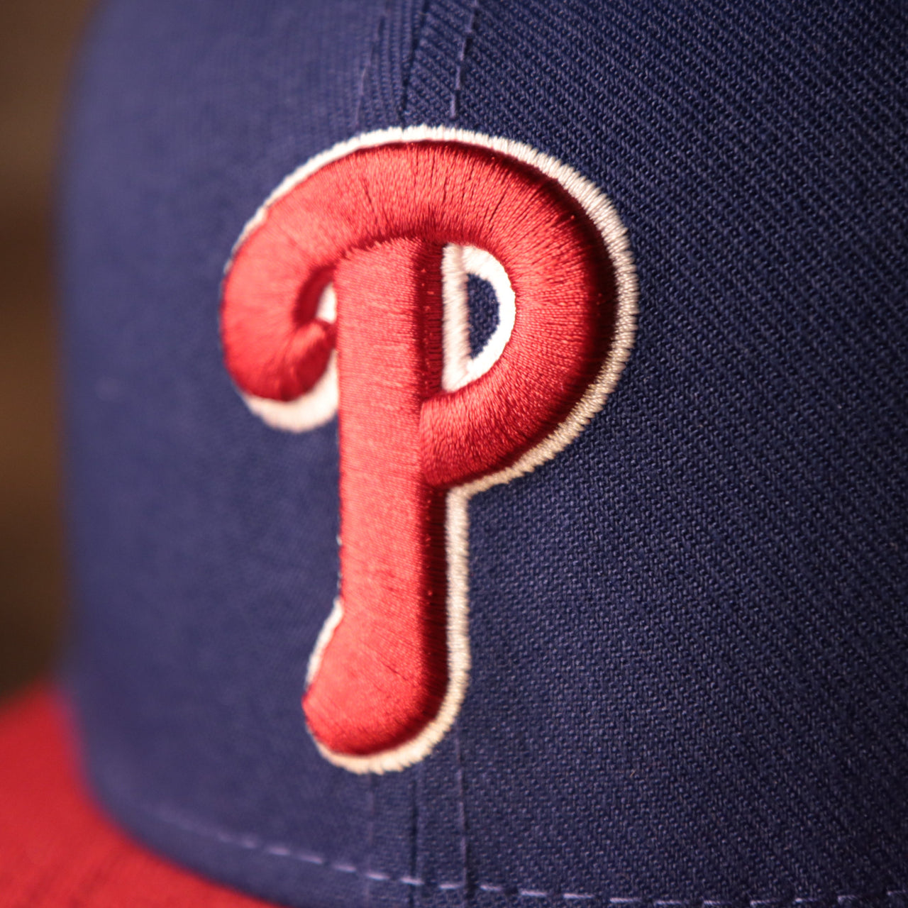 The Phillies Logo on the Philadelphia Phillies Blue on Red Game Authentic 59Fifty Fitted Cap