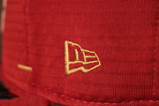 The new era logo is in gold 49ers 2020 Training Camp Snapback Hat | San Francisco 2020 On-Field Red Training Camp Snap Cap
