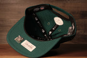 The underside of this jets training camp hat is green and has a sweatband Jets 2020 Training Camp Snapback Hat | New York Jets 2020 On-Field Green Training Camp Snap Cap