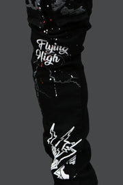 A close up of the custom graphics on the Fly High Custom Painted Cargo Denim Pants Motive Denim | Black | 