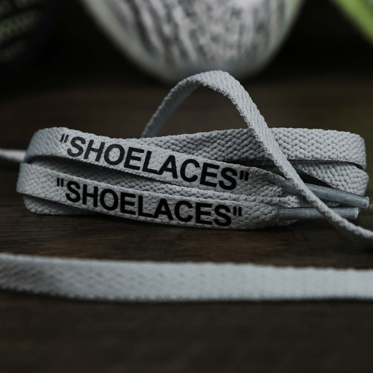 The Flat Icey Grey Shoelaces with “Shoelaces” Print | 120cm Capswag unfolded